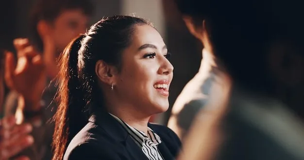 A close-up shot of a director smiling encouragingly at an actress during a rehearsal for a short film scene. This shows the director's role in creating a supportive environment for the actors, which is key in Directing Actors in Short Films: 5 Proven Techniques for Eliciting Powerful Performances.