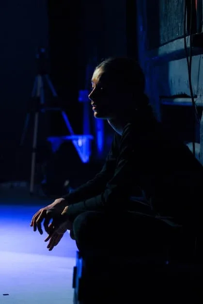 Will Graham (William Petersen) intensely studying crime scene photos, with neon lighting casting shadows across his face, conveying a sense of deep concentration and the psychological weight of the investigation. The image captures the film's stylish thriller aesthetic and is relatable to Unearthing Hidden Gems: 5 Overlooked Cult Classics from the 1980s You Need to See Before 2025.