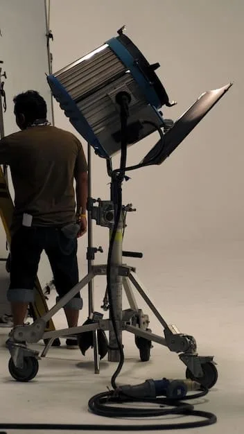 A behind-the-scenes shot of a short film crew setting up at a location, showcasing their efforts to maximize the existing environment with minimal alterations and strategic lighting.