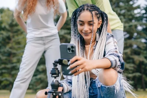 A diverse group of young filmmakers on a location shoot, using a smartphone camera and minimal equipment, highlighting accessibility and inclusivity in filmmaking.
