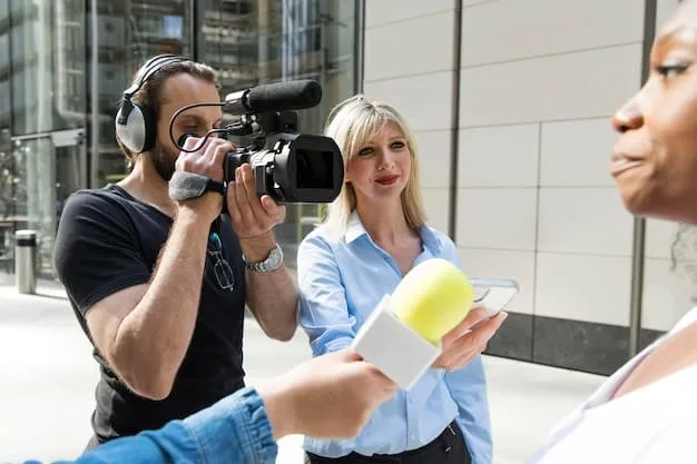 A filmmaker interacting with fans at a film festival, showcasing the importance of networking and community engagement in short film distribution.