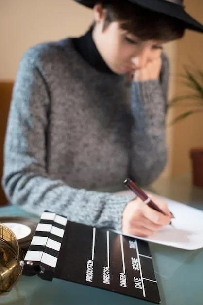 A close-up photo of a film critic taking notes during a screening at the Cannes Film Festival. The critic has a focused expression, and the details of their notepad and pen are visible.