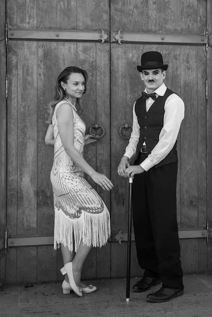 A black and white still photo of Charlie Chaplin in