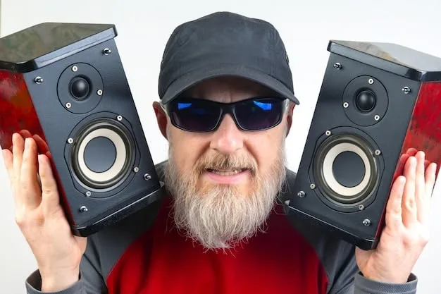 A close-up of Nigel Tufnel (Christopher Guest) proudly displaying his amplifiers, one of which is labeled as going up to