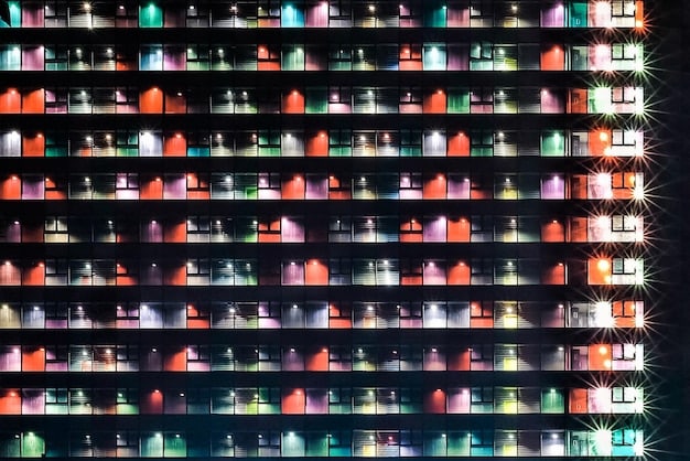 A dimly lit shelf lined with organized rows of VHS tapes, each carefully labeled and categorized. The lighting highlights the collection and creates a sense of order and dedication to the hobby.