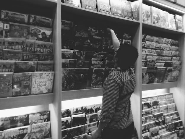A black and white image showing a group of people at a small, independent video store in the 1990s, browsing shelves filled with VHS tapes. The atmosphere is intimate and filled with anticipation.
