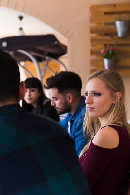 A bustling scene inside a film festival, with a filmmaker engaging in a lively discussion with potential investors and distributors. The atmosphere is vibrant and filled with anticipation.