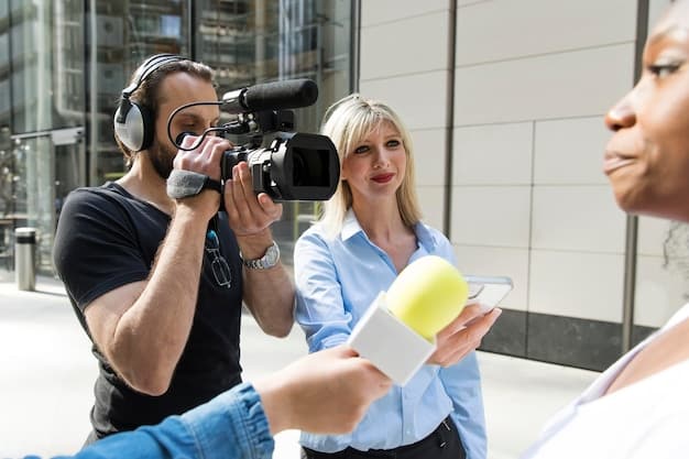 A filmmaker interacting with fans at a film festival, showcasing the importance of networking and community engagement in short film distribution.