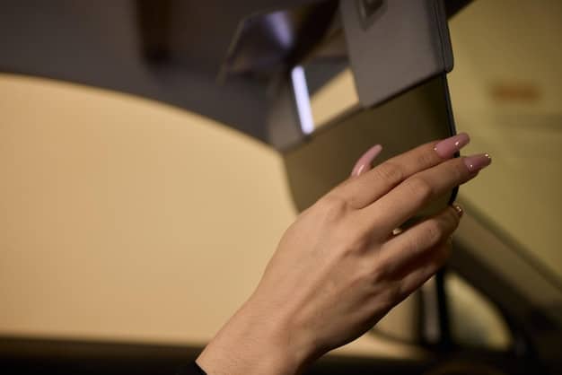 A close-up shot of a DIY softbox made from cardboard, diffusion paper, and a clamp light. The softbox is illuminating a small object, showcasing the smooth and even light it produces.