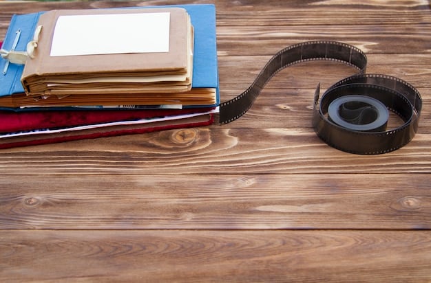A close-up shot of a filmmaker meticulously preparing submission materials, including a printed synopsis, film stills, and a DVD copy of their short film, all neatly organized in a folder.