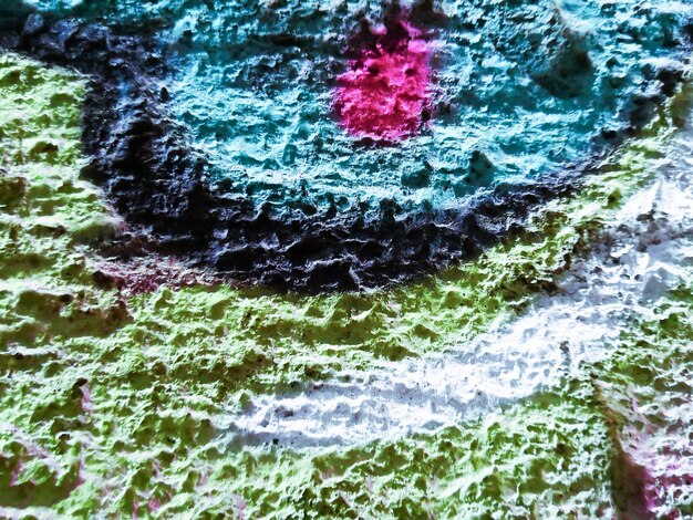 A close-up image of a painting by  showing the intricate brushwork and textures. The colors are rich and vibrant, and the details are rendered with great care and skill. The image highlights the artist's technical mastery and attention to detail.