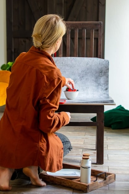 A modern photograph of an art restorer carefully cleaning an old painting in a studio. The painting is partially cleaned, revealing vibrant colors beneath layers of accumulated dirt and varnish, symbolizing the process of rediscovering forgotten masterpieces.