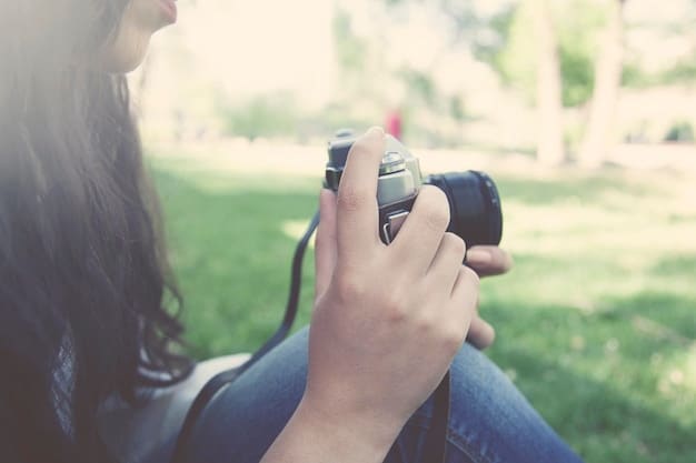 A close-up of someone using a portable audio recorder in an outdoor setting, capturing ambient sounds for use in a short film. The person is wearing headphones and focused on recording the natural sounds of wind, leaves, and distant traffic, relevant to Short Film Sound Design: Creating Immersive Audio Experiences on a Limited Budget.