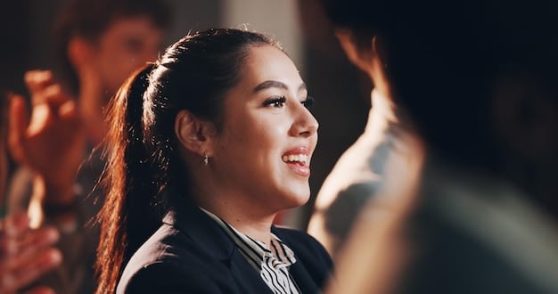 A close-up shot of a director smiling encouragingly at an actress during a rehearsal for a short film scene. This shows the director's role in creating a supportive environment for the actors, which is key in Directing Actors in Short Films: 5 Proven Techniques for Eliciting Powerful Performances.