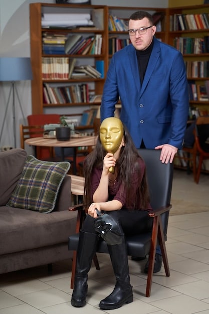 A film director on set inspecting an intricate creature head puppet with an actor, while digital screens in the background show preliminary CGI composites, showcasing a hybrid approach of practical and digital effects.