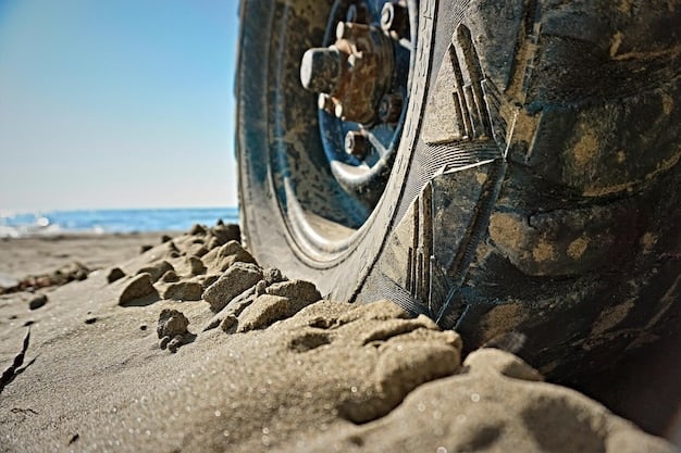 A close-up shot of a truck wheel precariously navigating a large, jagged rock on a dirt road. The lighting is harsh, highlighting the roughness of the terrain. This single moment encapsulates The Power of Location Shooting: How 'The Wages of Fear' (1953) Created Unparalleled Tension, emphasizing the constant threat faced by the nitroglycerin-laden trucks.