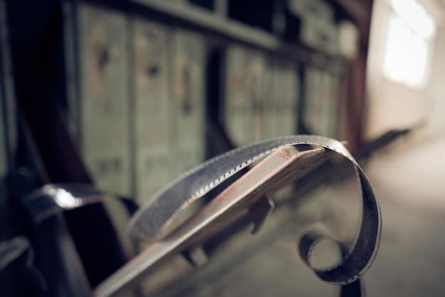 A close-up shot of a film reel being carefully inspected by a film archivist wearing gloves. The lighting is focused and precise, highlighting the detail of the film and the archivist's meticulous work. The scene represents the dedication required for 