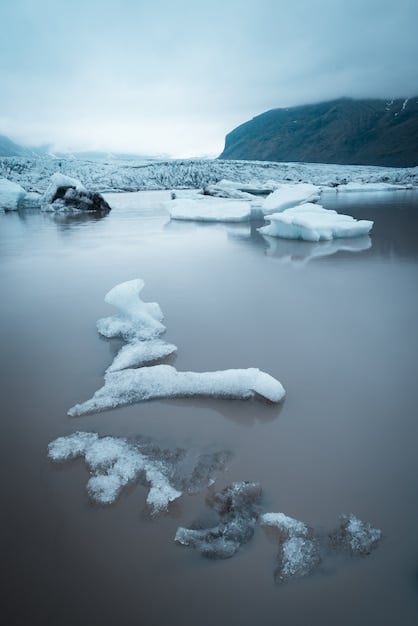 A still from a documentary focused on climate change in the Arctic, showing melting ice caps and indigenous communities affected by the environmental changes. The image should emphasize the global impact of climate change and the human stories behind the data. Mention 'The Power of Documentary: Exploring Social Issues Through International Lenses' in the image's context.