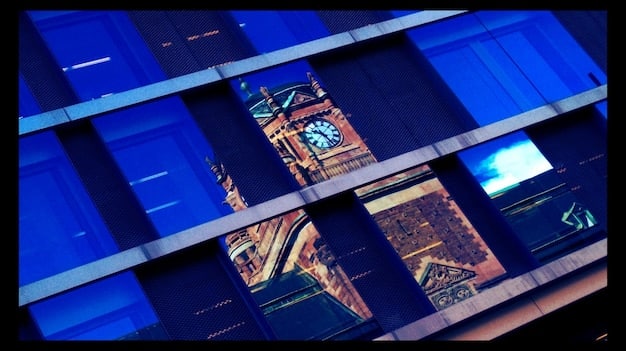 A digital film editing suite with multiple screens displaying film reels and timelines, showcasing advanced restoration software.